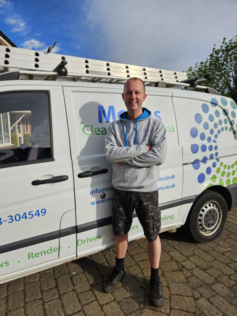 Steven Mallaber standing next to his works van